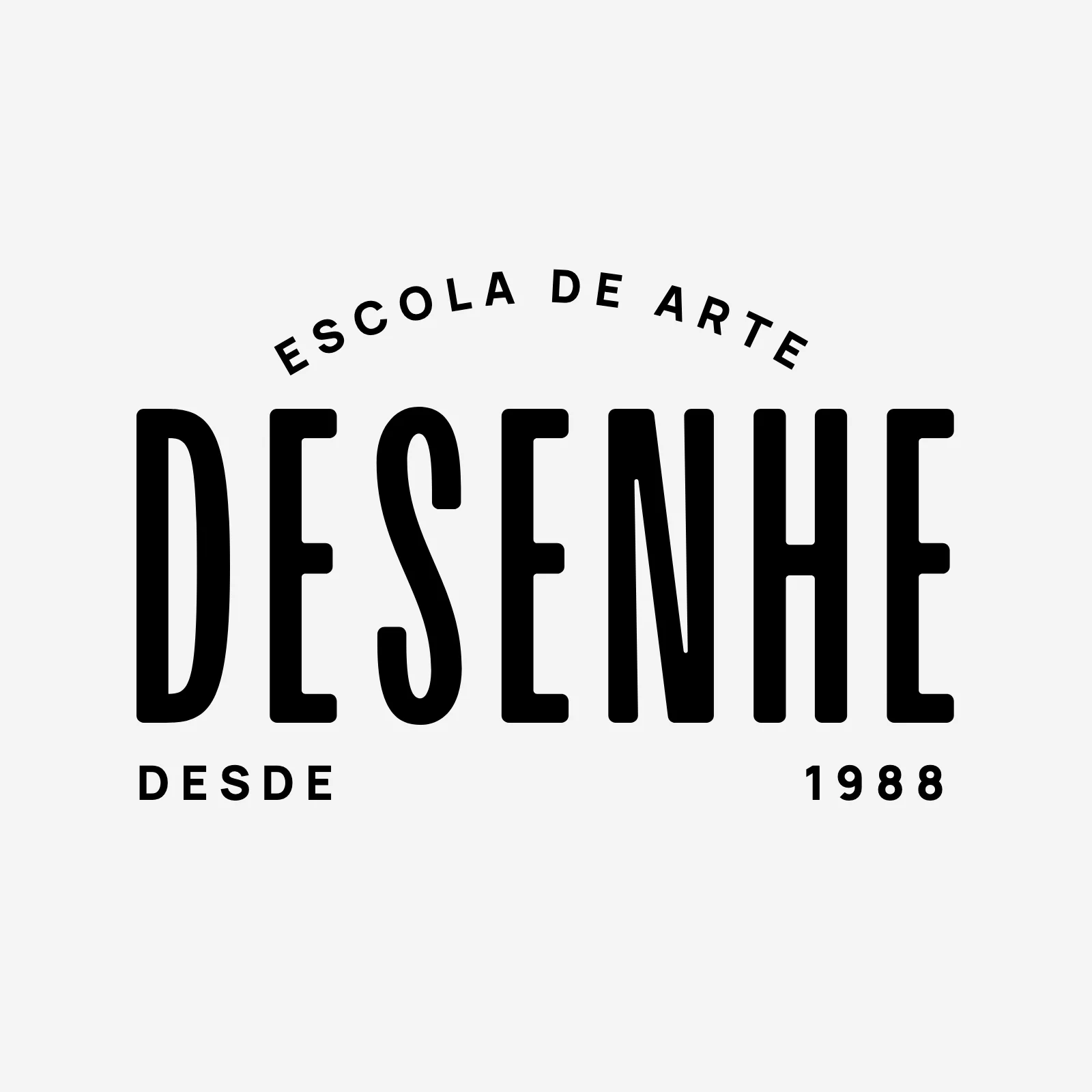 Vertical seal in black on light gray: Art School in an arc above the name DESENHE and, below, Since 1988