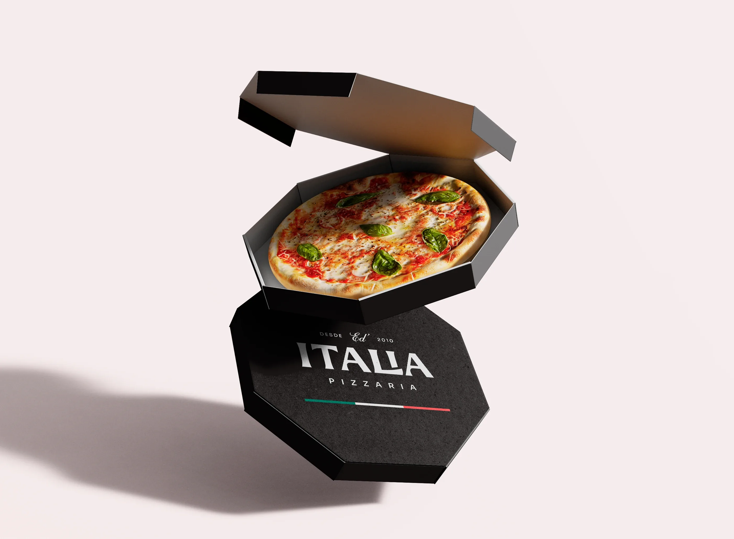 Black octagonal Ed' Italia Pizzeria box, open, with a basil pizza inside