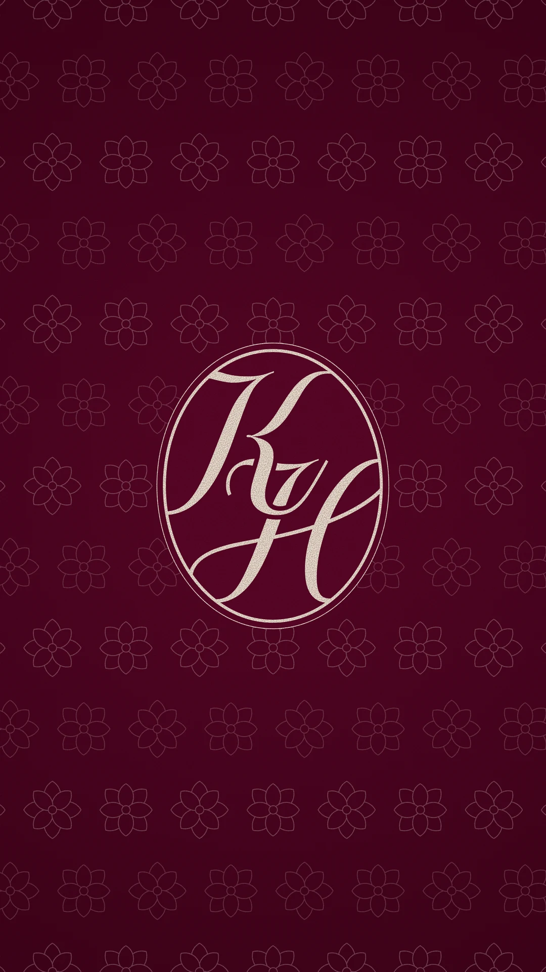 KH monogram in cream over the bordeaux flower pattern