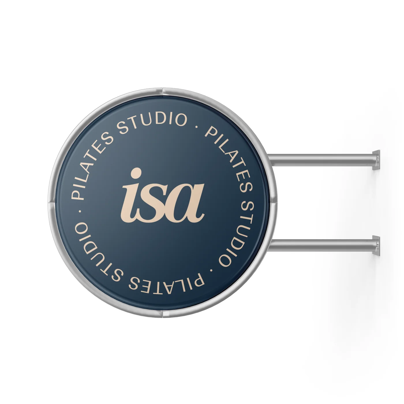 Circular wall sign, blue, with the isa monogram and the line Pilates Studio