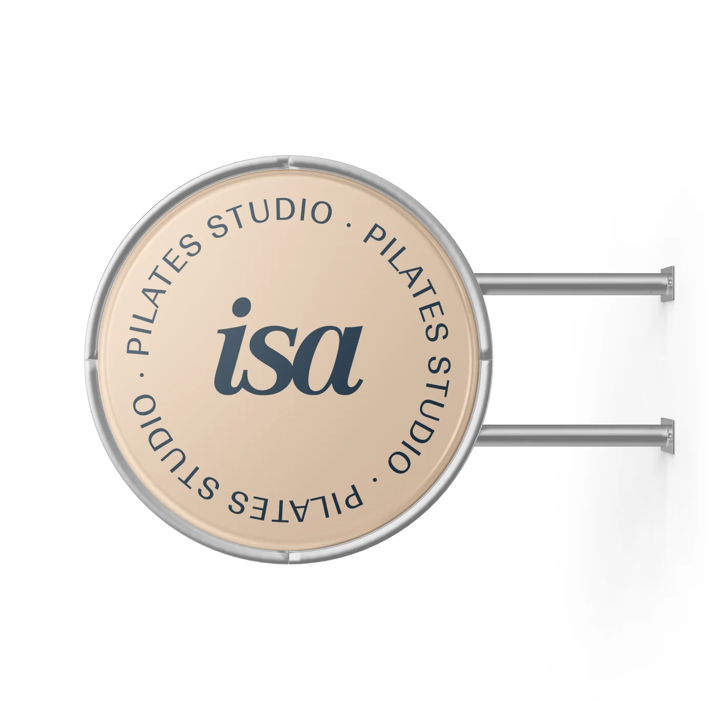 Circular wall sign, beige, with the isa monogram and the line Pilates Studio