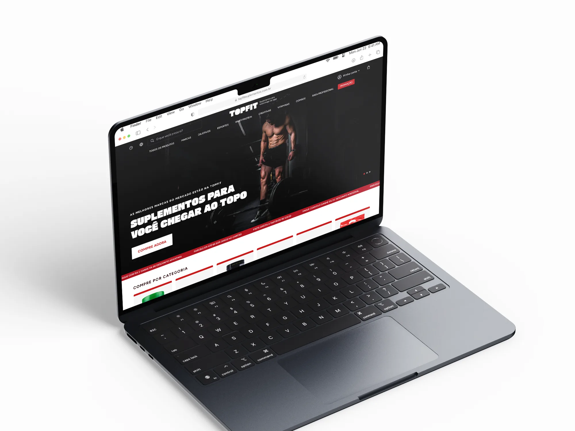 Laptop showing the TOPFIT online store home, with the tagline over a workout photo